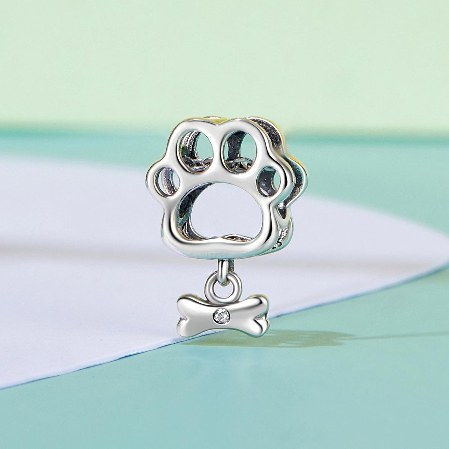 Hollowed Dog Paw Charm